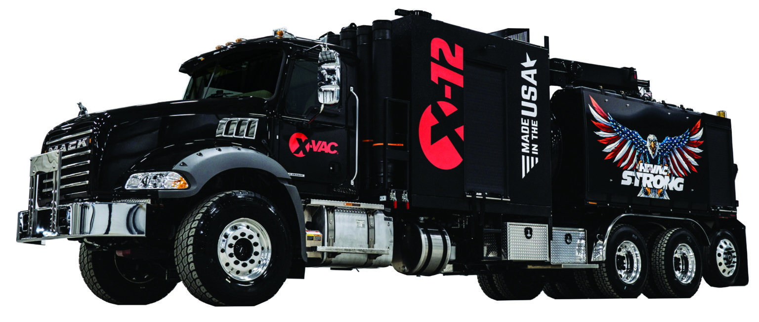Black Mack vacuum-excavation truck with X-Vac and X-72 markings, patriotic eagle graphic and Made in the USA on the tank.